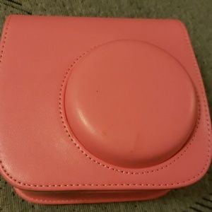 A baby pink Polaroid set